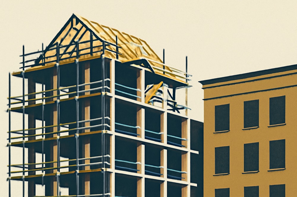 Mid-rise residential building under construction with exposed concrete and timber roof elements